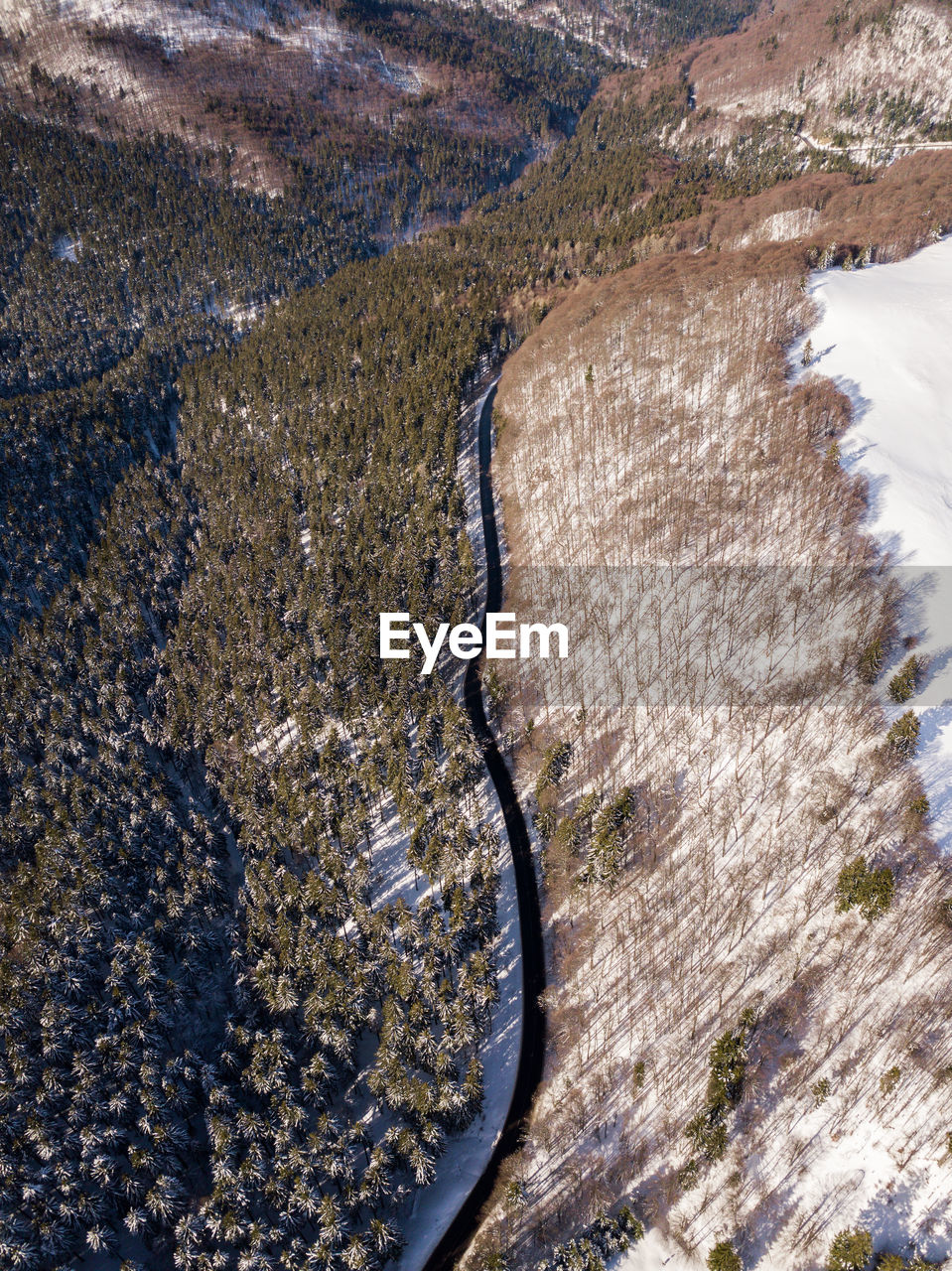 High angle view of river amidst field