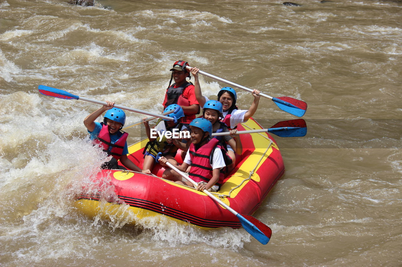 High angle view of people in boat at river