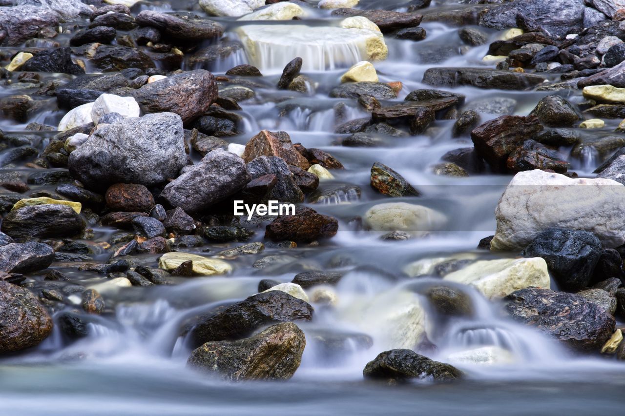 water, river, stream, beauty in nature, rock, motion, nature, rapid, body of water, scenics - nature, land, no people, watercourse, autumn, environment, long exposure, outdoors, flowing water, flowing, stream bed, blurred motion, day, tranquility, wet, water feature, creek, landscape