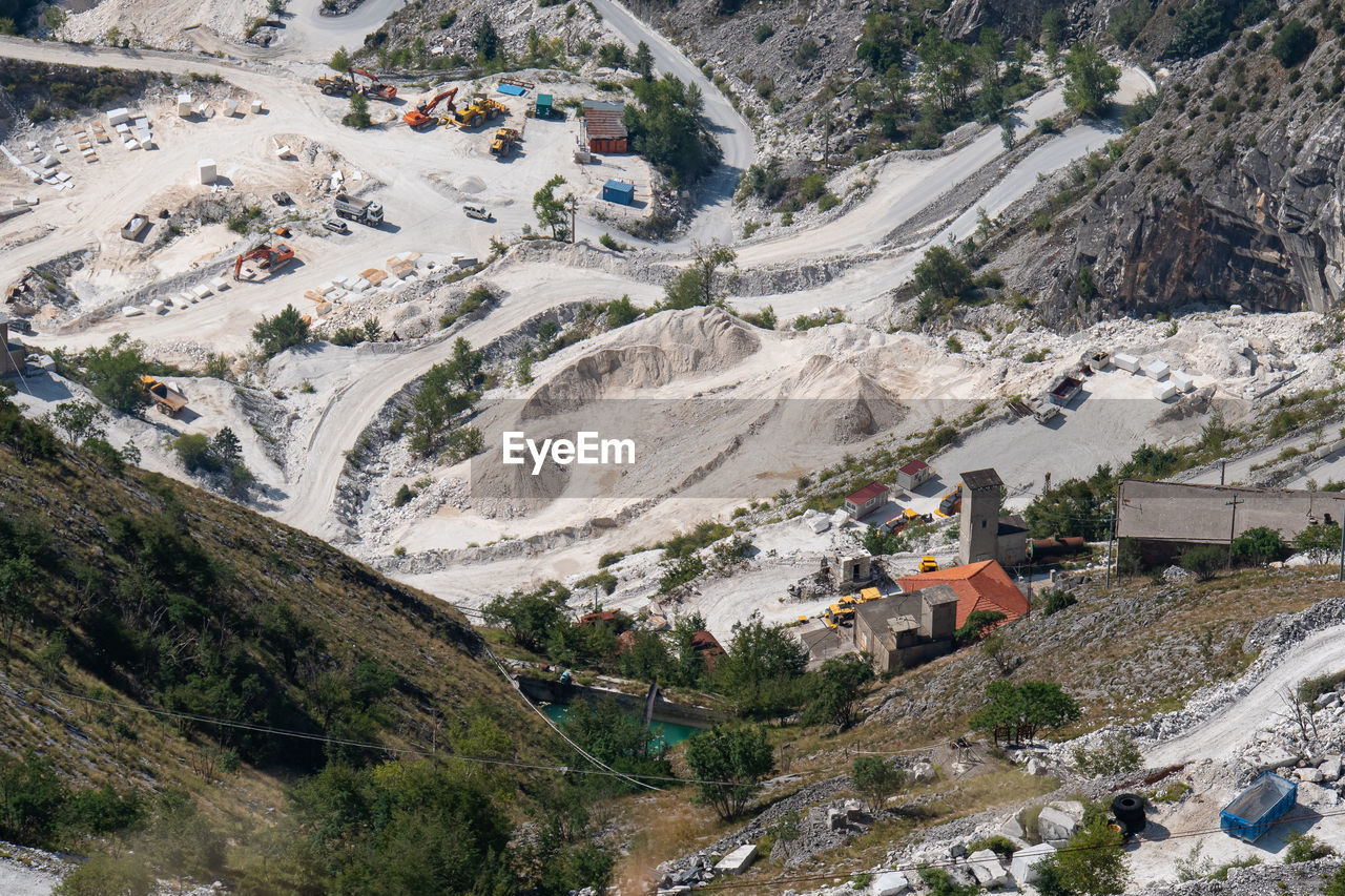 View of the carrara marble quarries with excavation equipment ready for work.