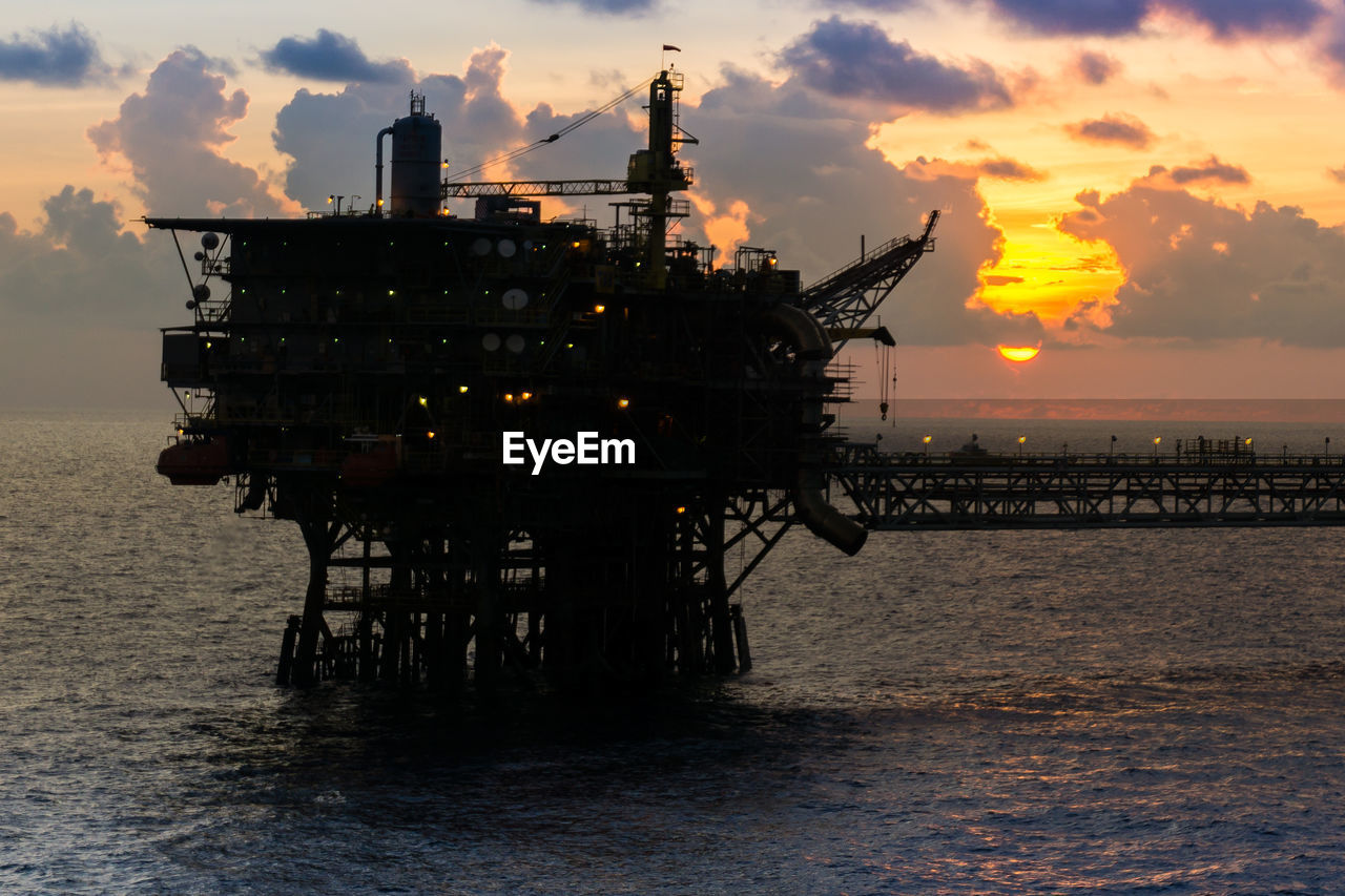 Silhouette of an offshore platform during sunset at offshore terengganu oil field