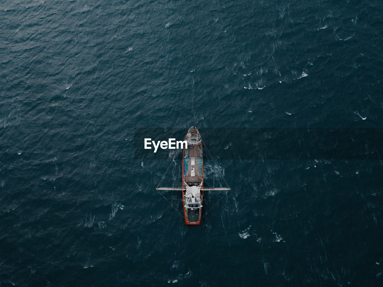 Aerial view of boat sailing in sea