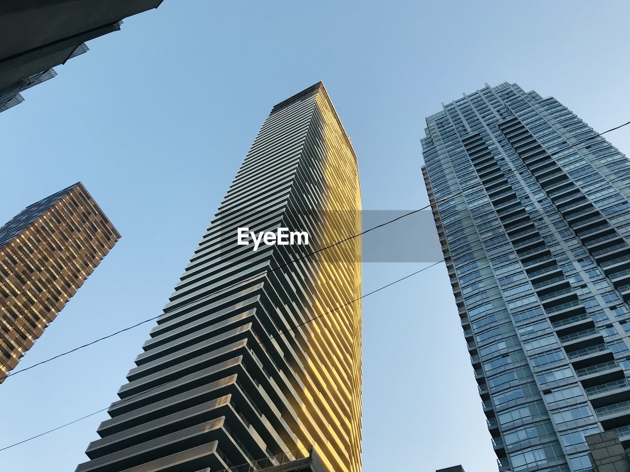 Low angle view of modern buildings against clear sky skyline highest