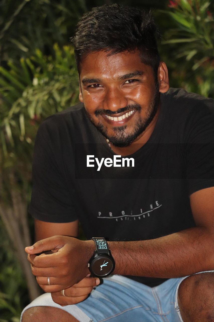 adult, smiling, men, portrait, happiness, watch, one person, person, emotion, lifestyles, cheerful, casual clothing, relaxation, leisure activity, nature, young adult, human face, enjoyment, looking at camera, positive emotion, outdoors, looking, fashion accessory, headshot, clothing, hand, smile, limb, day, teeth