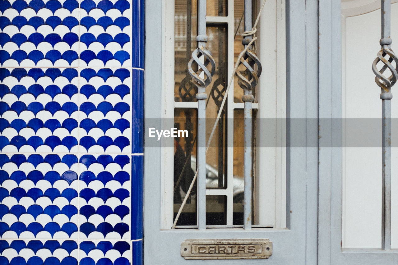 Close-up of door and patterned wall