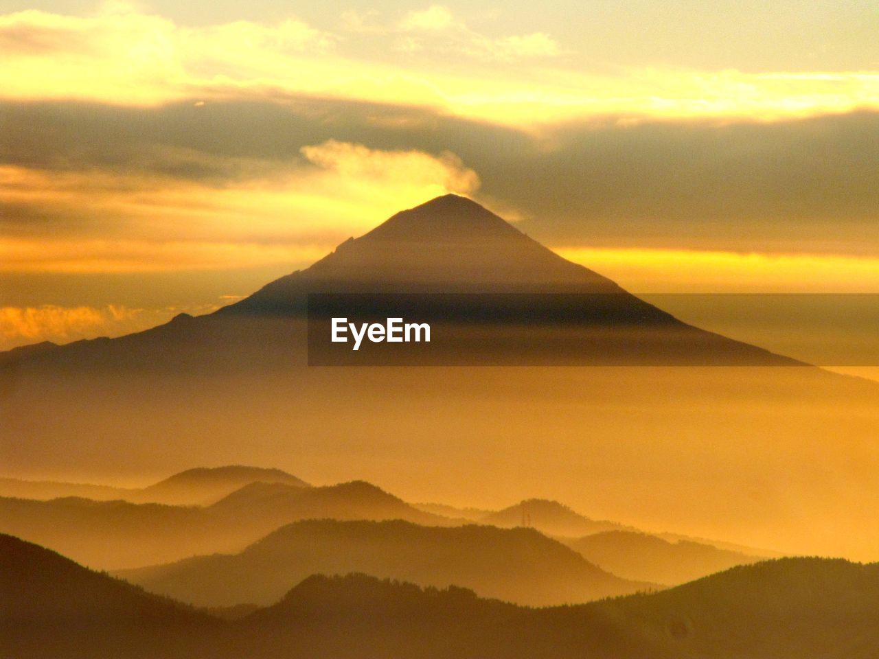 SCENIC VIEW OF MOUNTAIN AGAINST SKY DURING SUNSET