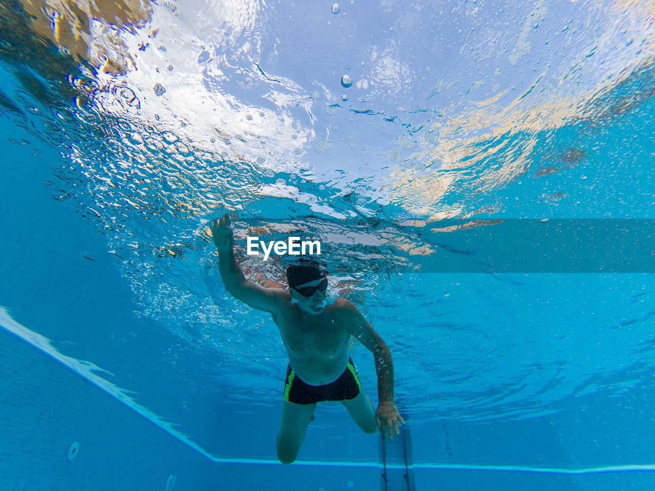 Man swimming in pool