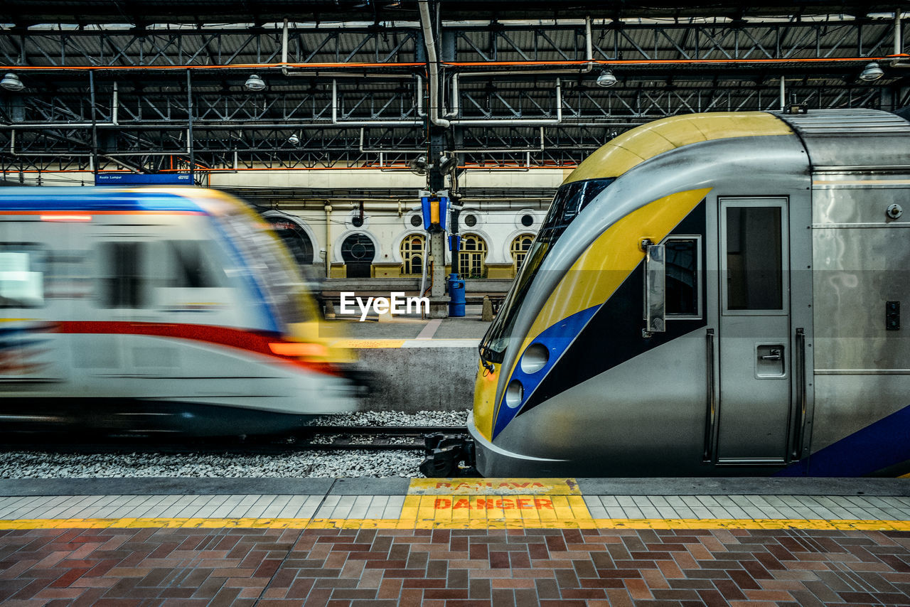 Blurred motion of trains at railroad station