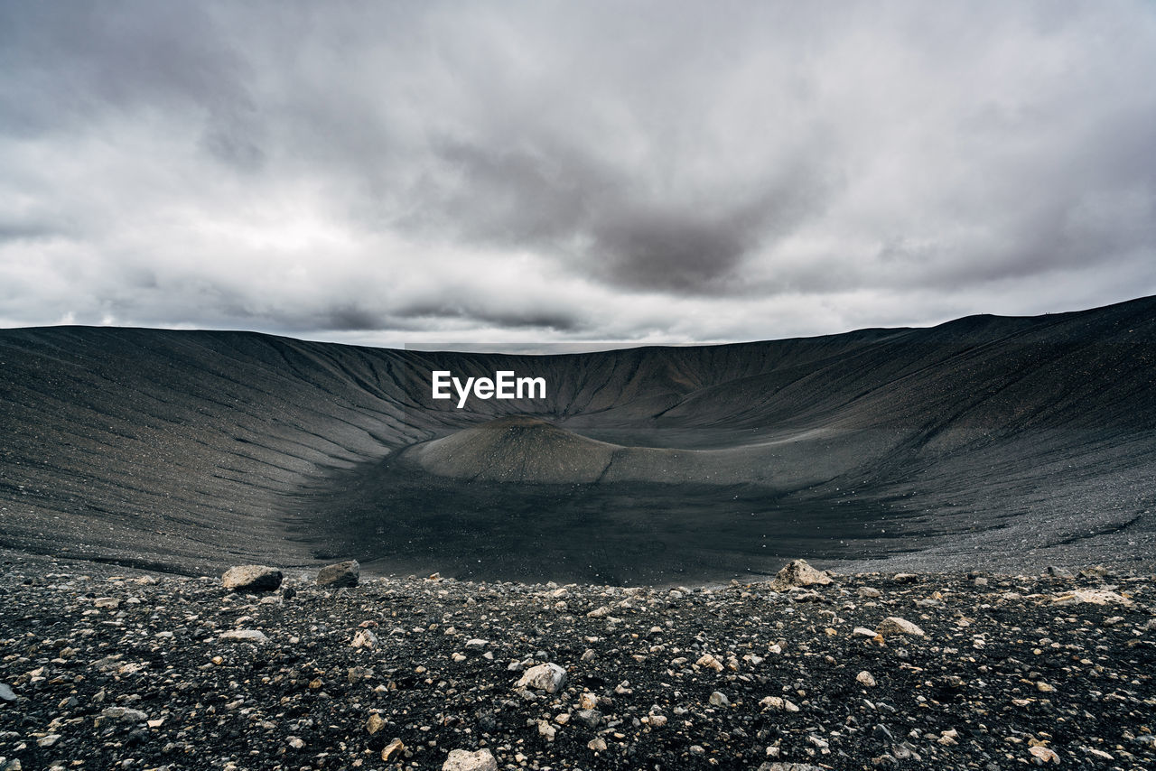 Scenic view of hverfjall against cloudy sky