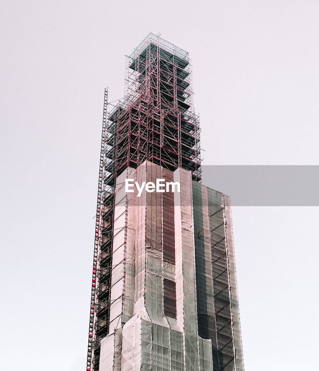 Low angle view of under construction building against clear sky