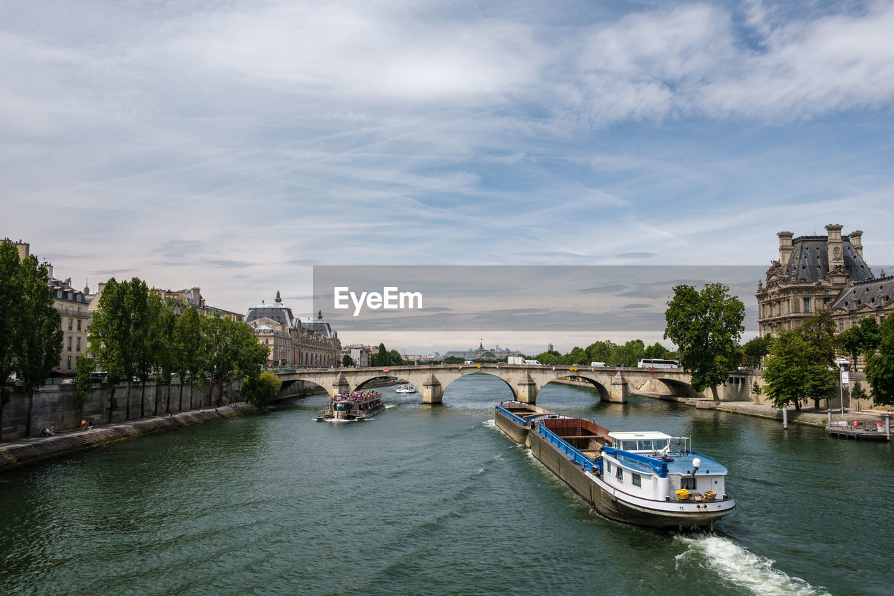 Paris, boats in river with city in background