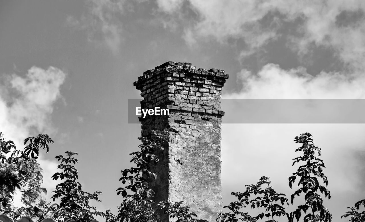black and white, sky, architecture, monochrome photography, monochrome, cloud, tree, built structure, nature, history, plant, no people, the past, low angle view, building exterior, outdoors, travel destinations, building, tower, old ruin, travel, environment