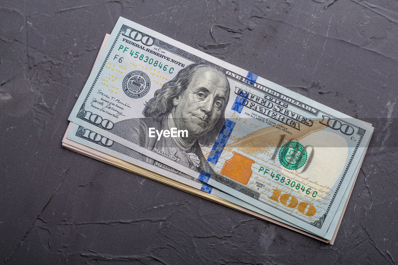 currency, paper currency, finance, business, money, cash, wealth, human representation, representation, human face, dollar, business finance and industry, person, male likeness, banknote, close-up, finance and economy, high angle view, paper, money handling