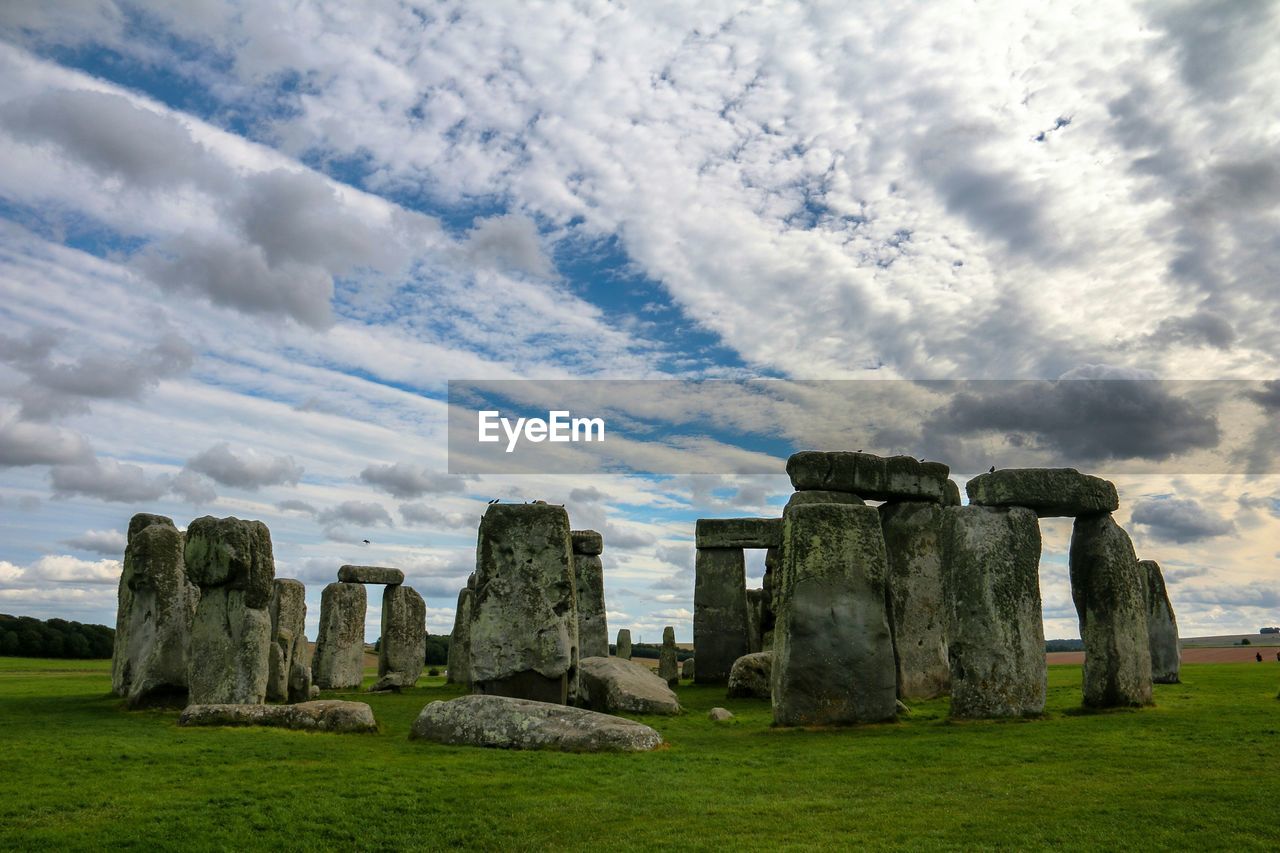 Scenic view of stonehenge against cloudy sky