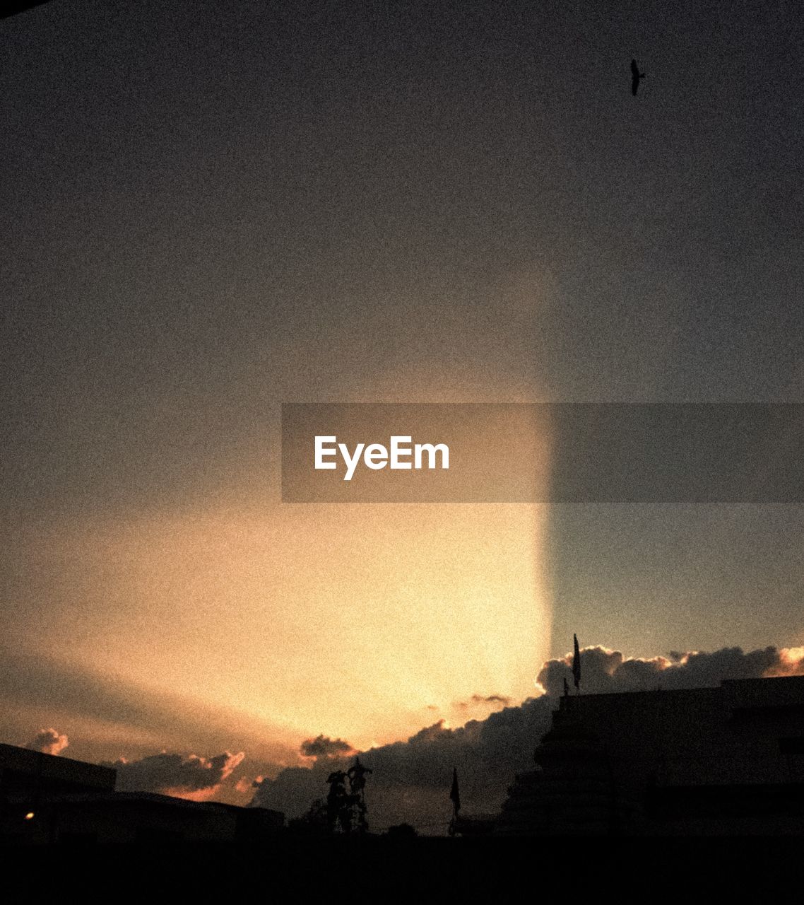 SILHOUETTE BUILDINGS AGAINST SKY DURING SUNSET