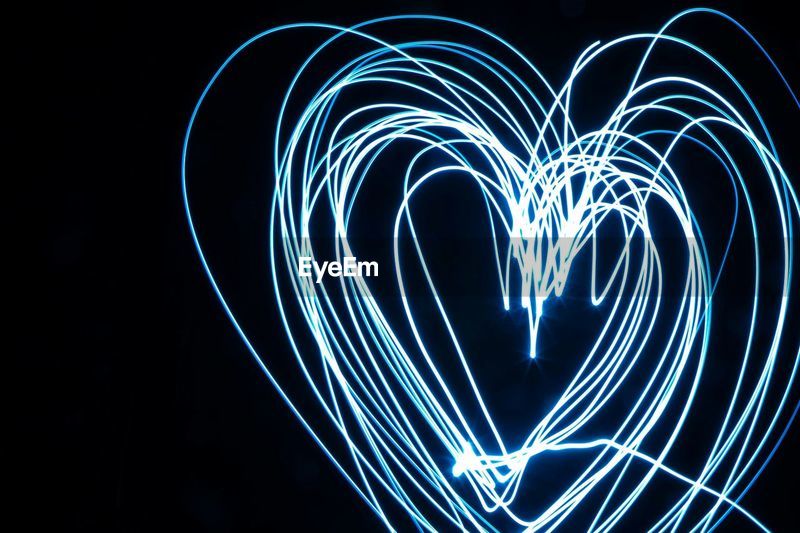 Heart shape drawn by light painting at night | ID: 70574460