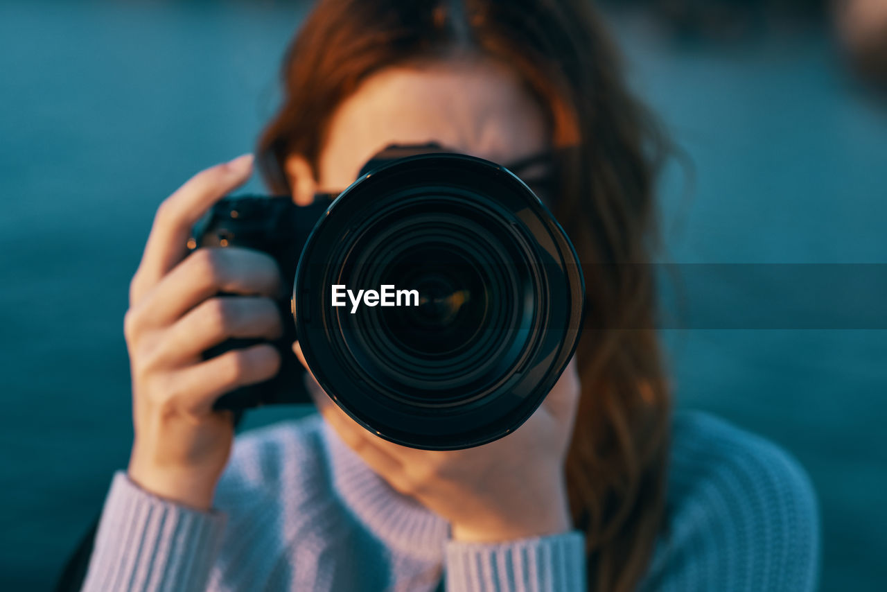 Close-up of woman photographing