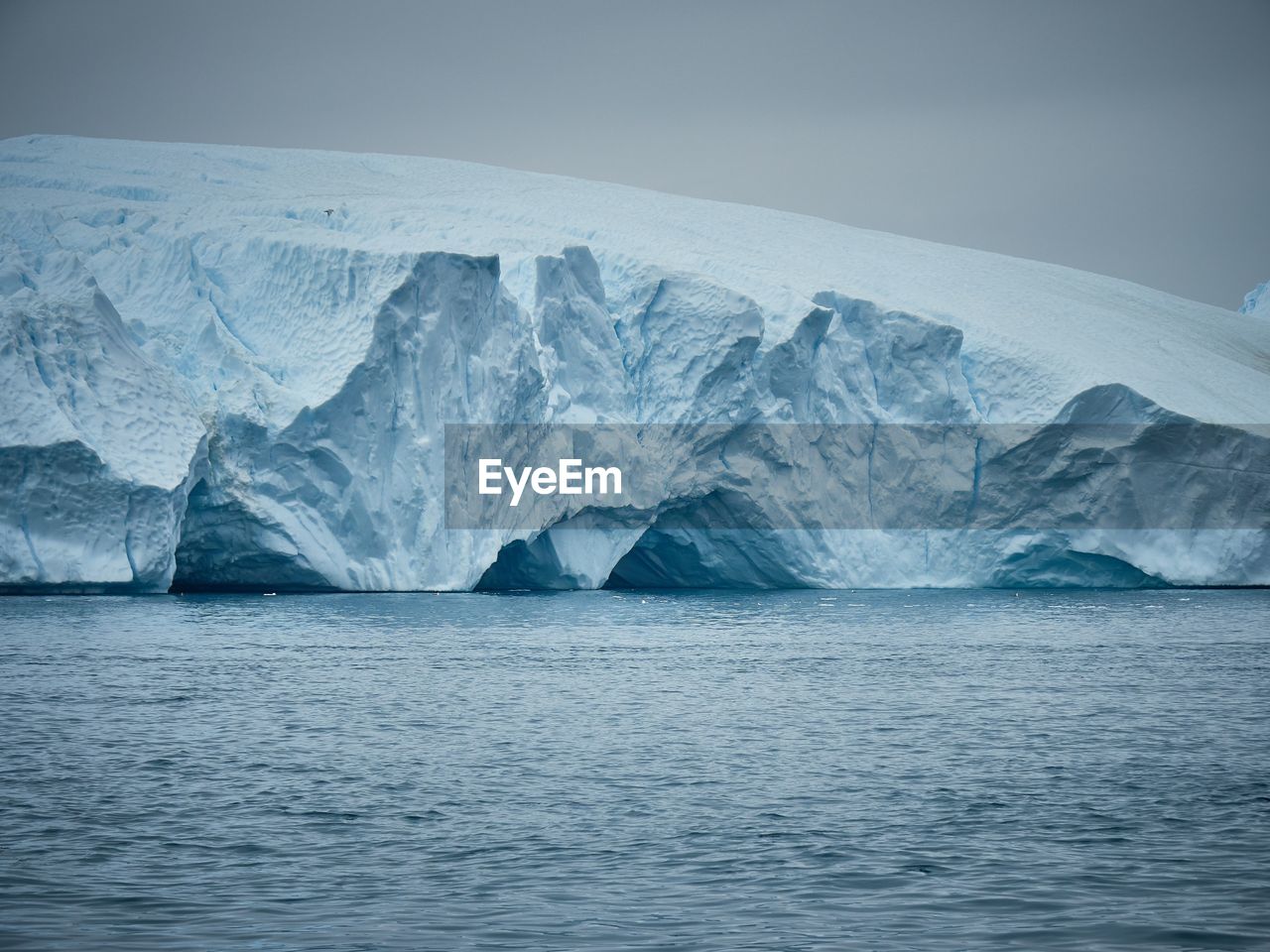 Scenic view of frozen sea against sky