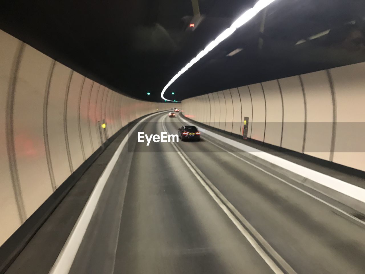 CARS MOVING IN TUNNEL