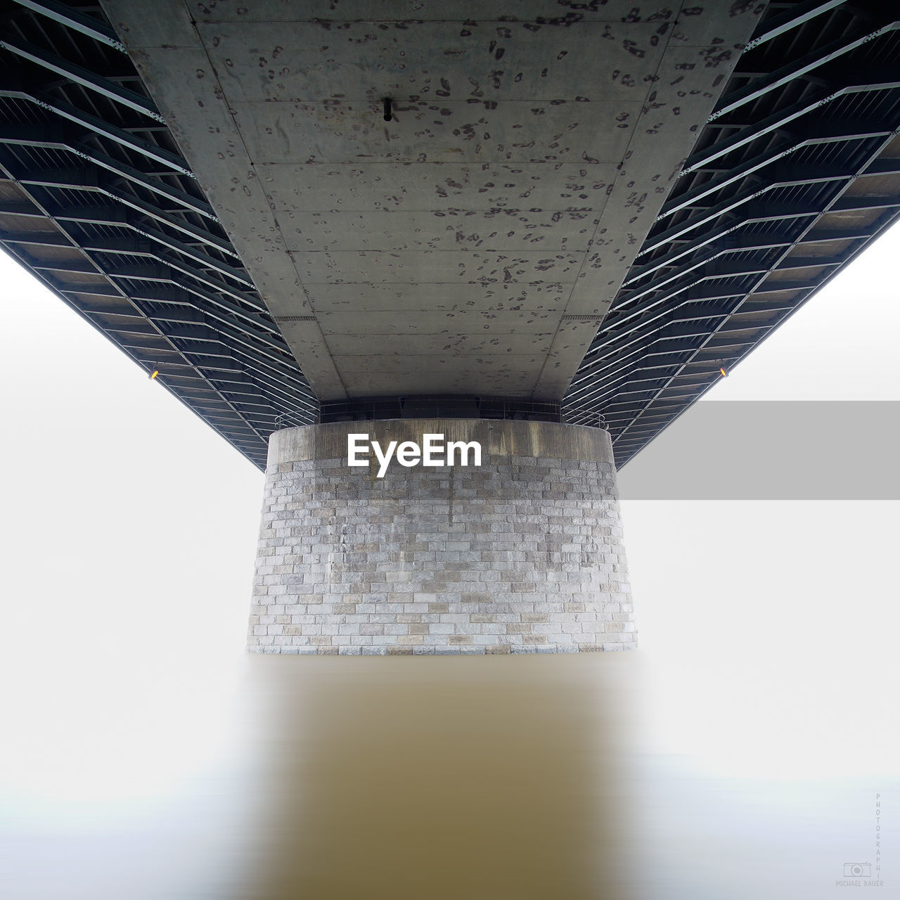 LOW ANGLE VIEW OF BRIDGE AGAINST CLOUDS