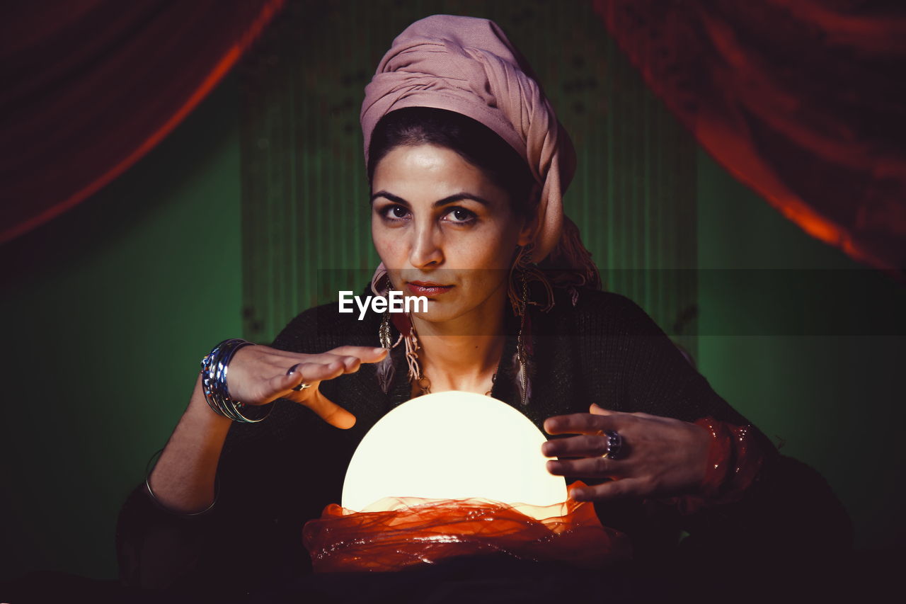 Female fortune teller with crystal ball