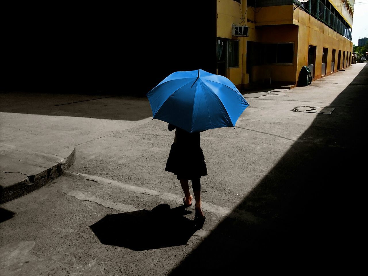 Woman walking with umbrella