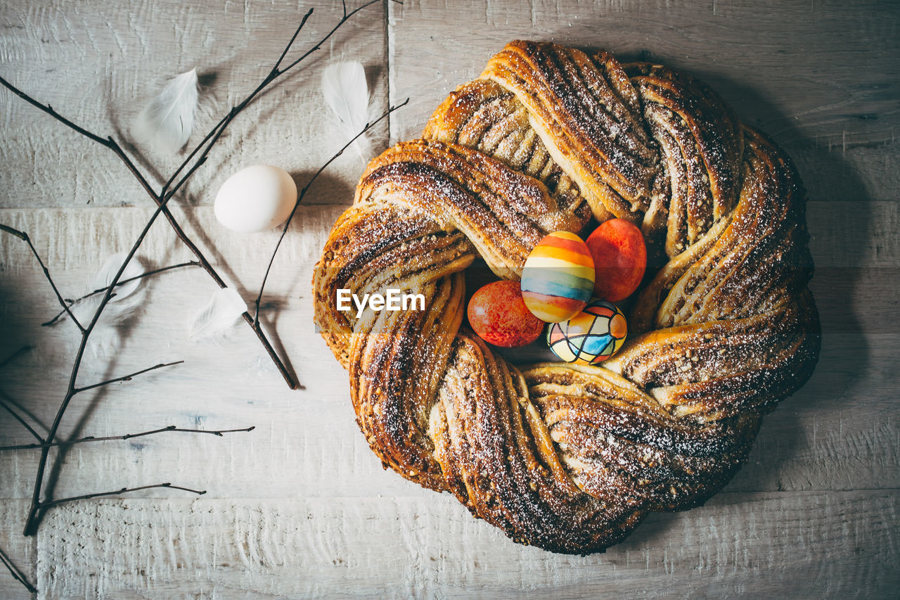 Directly above shot of easter eggs on bread at table