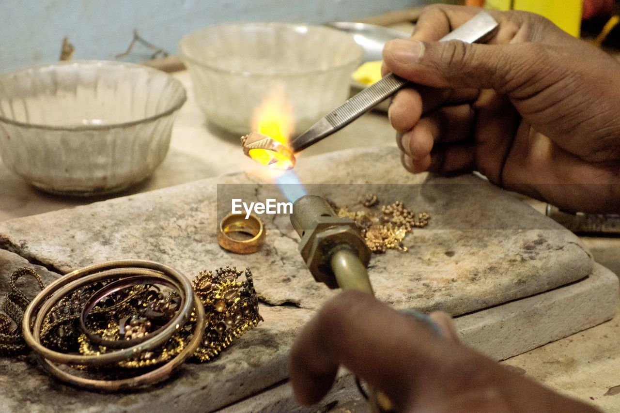 Goldsmith working with a unfinished ring
