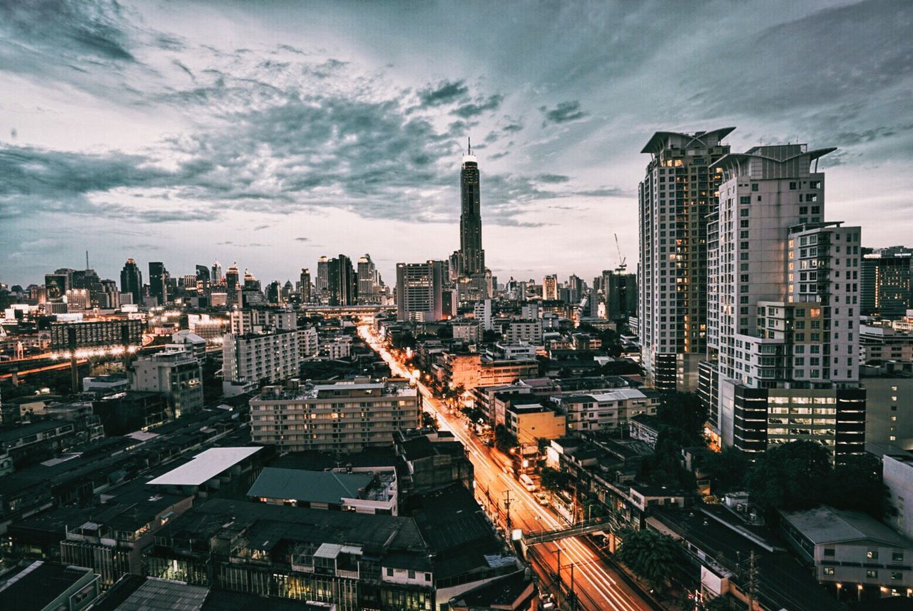 HIGH ANGLE VIEW OF CITY STREET AGAINST SKY