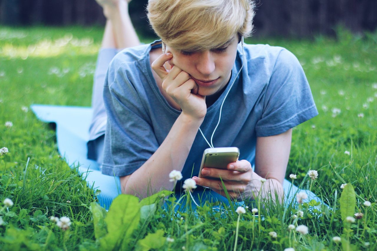 Boy listening music while using mobile | ID: 139186062