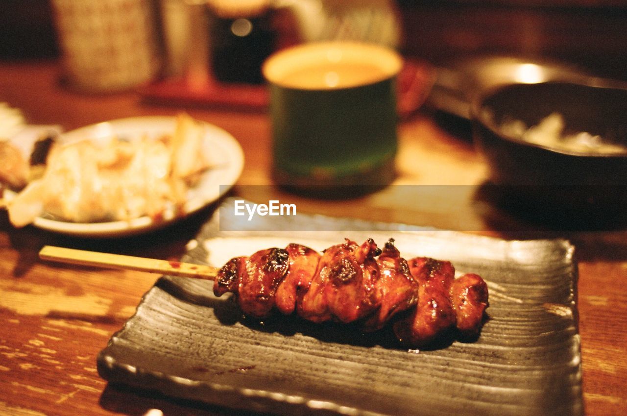 Close-up of fresh yakitori served in plate on table