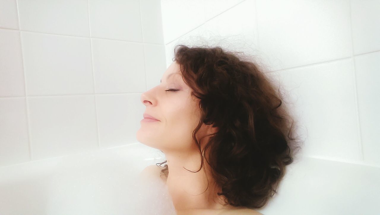 Happy Woman Relaxing In Bathtub At Home On Eyeem
