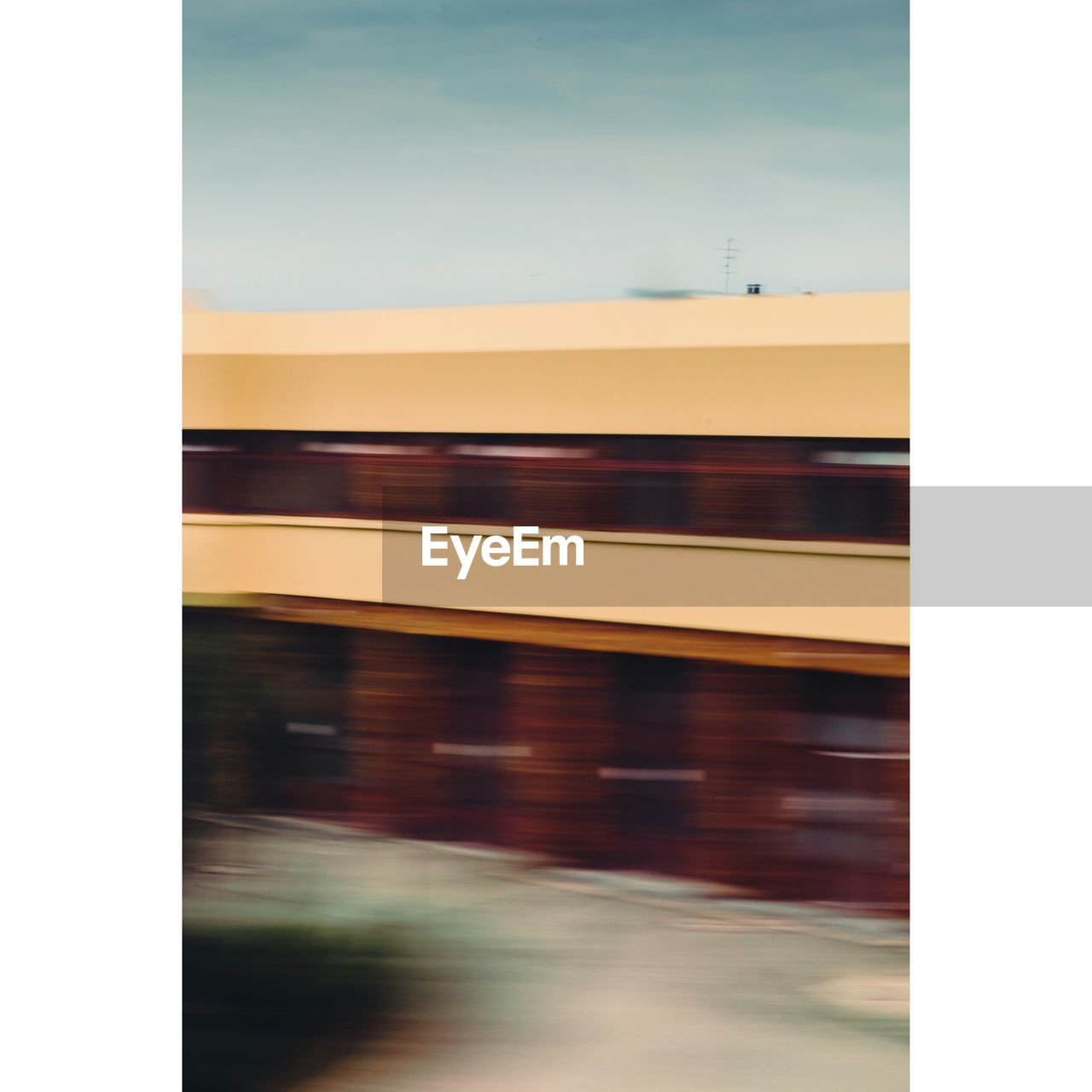 BLURRED MOTION OF TRAIN AT RAILWAY STATION