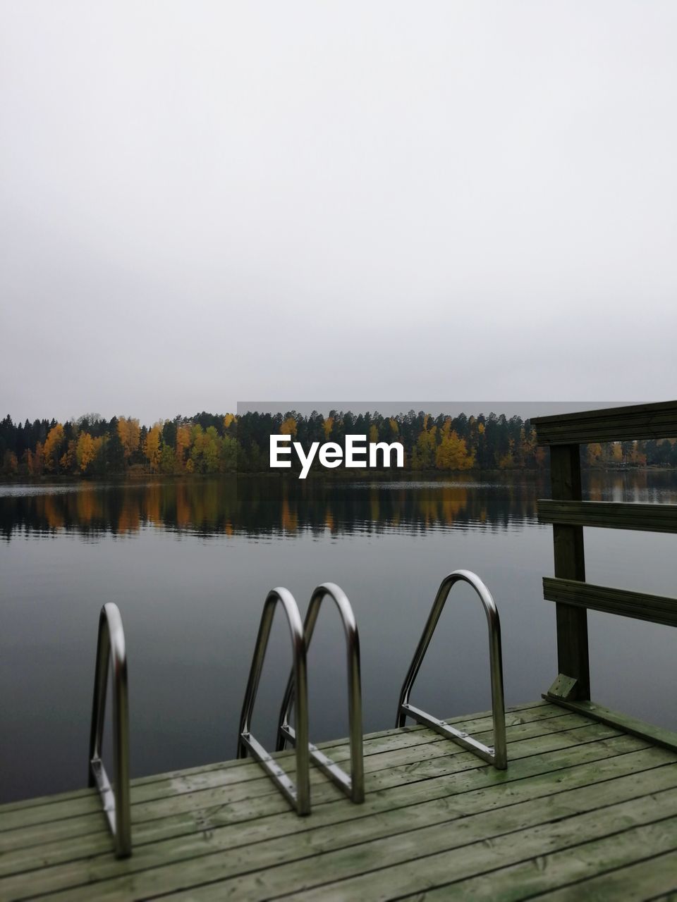 VIEW OF SWIMMING POOL BY LAKE AGAINST SKY