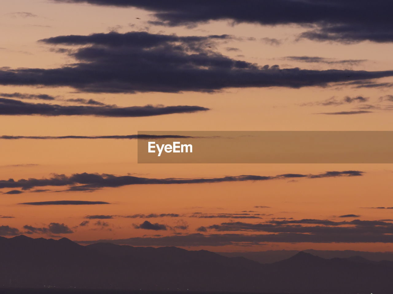 SCENIC VIEW OF DRAMATIC SKY OVER SILHOUETTE LANDSCAPE