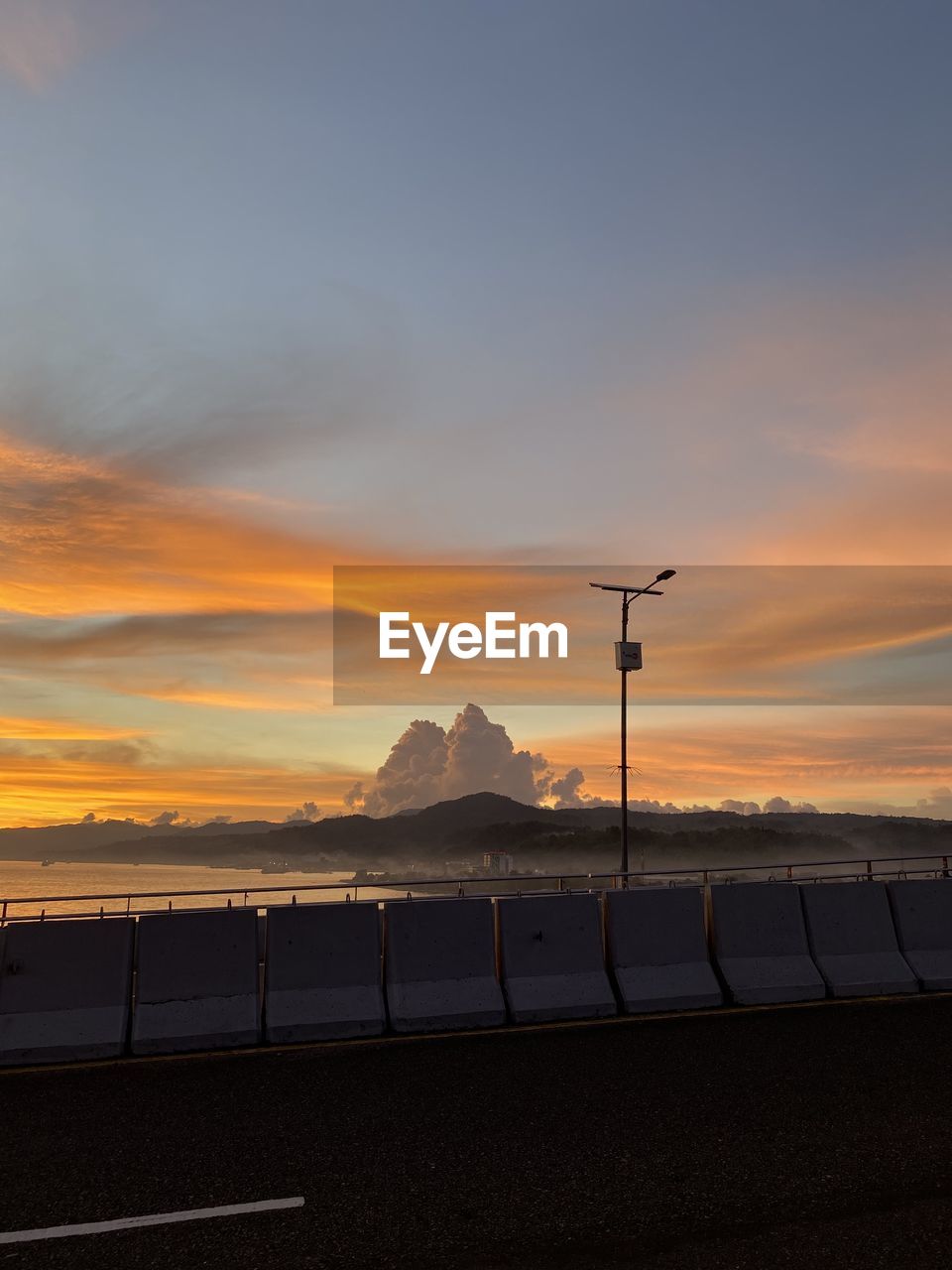 Sunset sky cloud lamp street outdoor evening peace object nature no people sea water good feeling