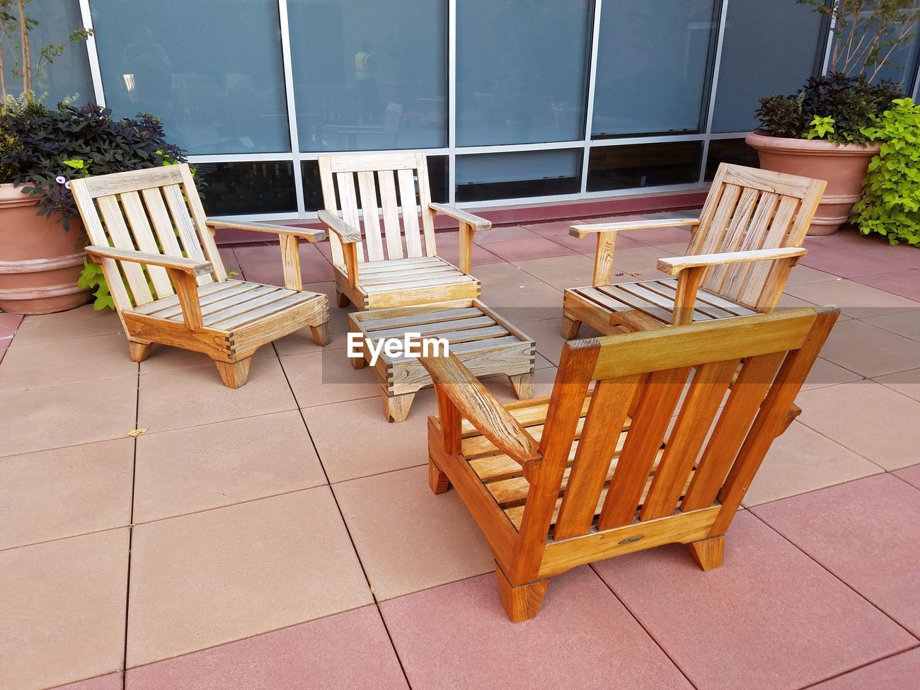 Empty Wooden Chairs Outside Building Id 93559854