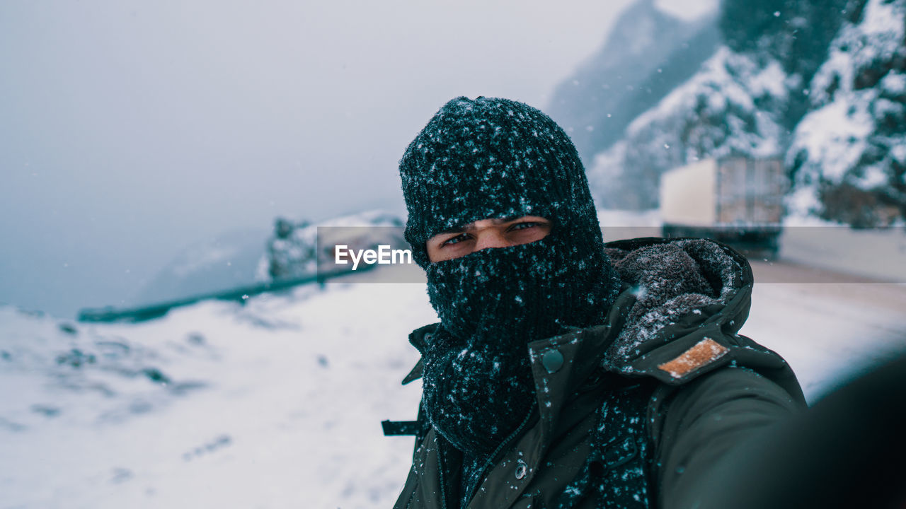 Portrait of man wearing hat during winter