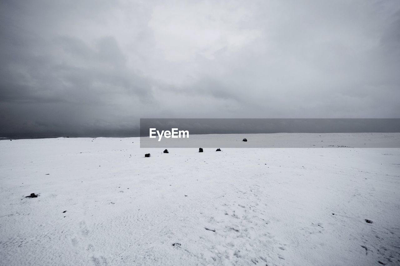 VIEW OF SEA AGAINST CLOUDY SKY