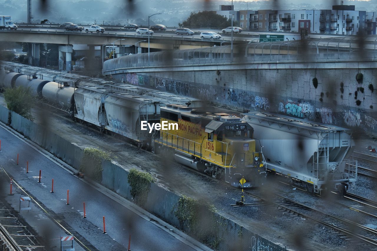 High angle view of train on railroad tracks seen through window