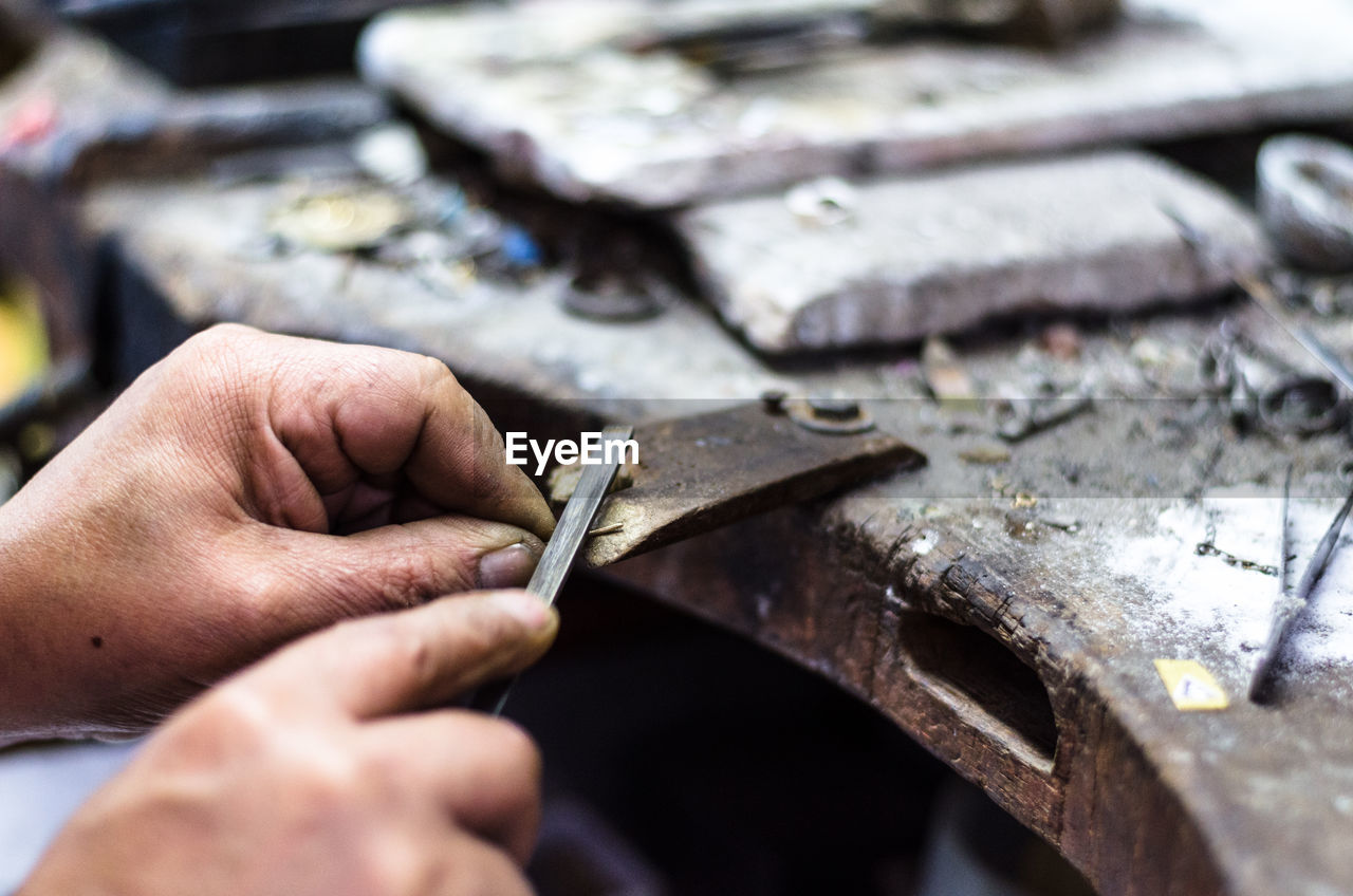 Close-up of jeweller working in workshop