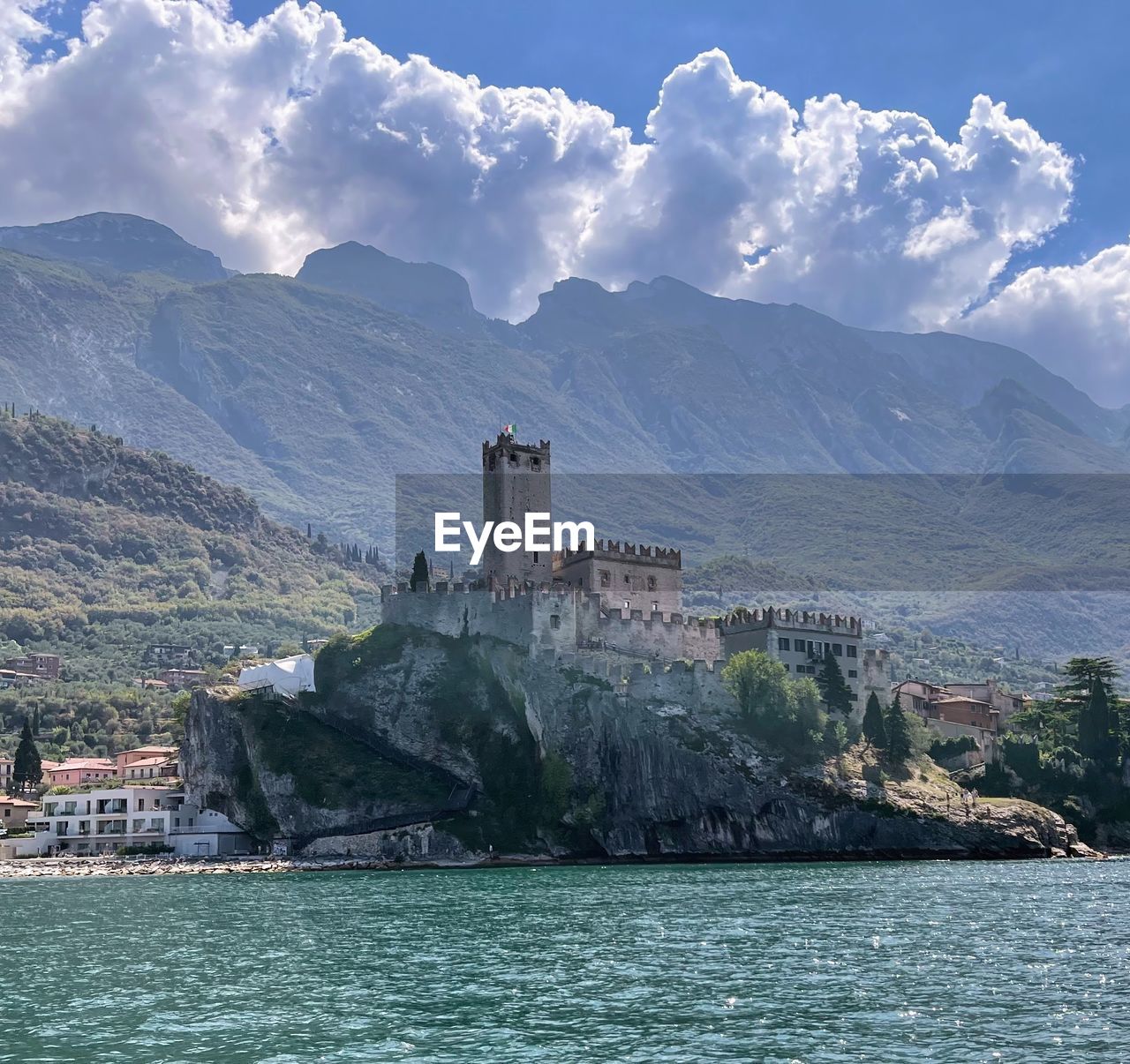 architecture, water, built structure, mountain, building exterior, building, sky, sea, nature, travel destinations, environment, land, landscape, travel, scenics - nature, history, the past, cloud, coast, tower, bay, tourism, city, beauty in nature, no people, mountain range, outdoors, blue, religion, beach, coastline, lighthouse, day, house, island