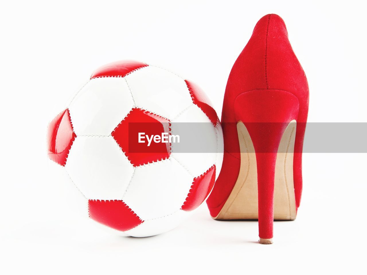 LOW ANGLE VIEW OF RED BALL AND WHITE BACKGROUND