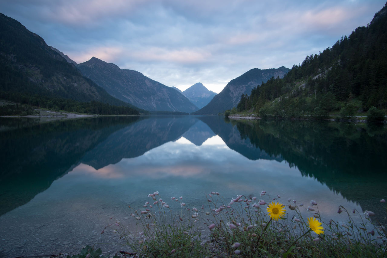 Scenic view of lake and mountains against sky -  plansee, reutte, austria 