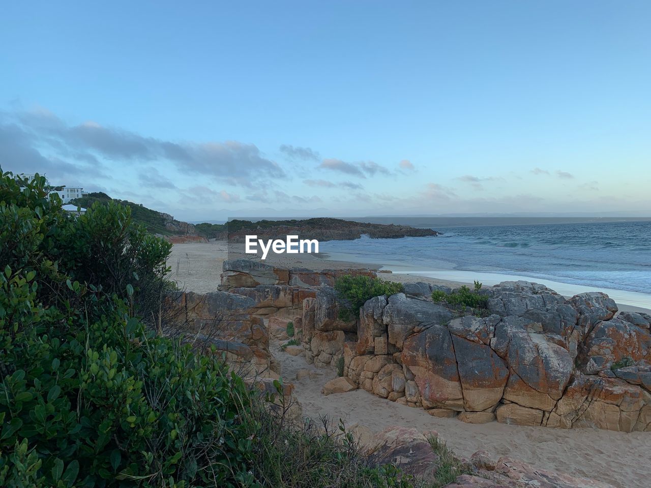 Scenic view of beach against sky