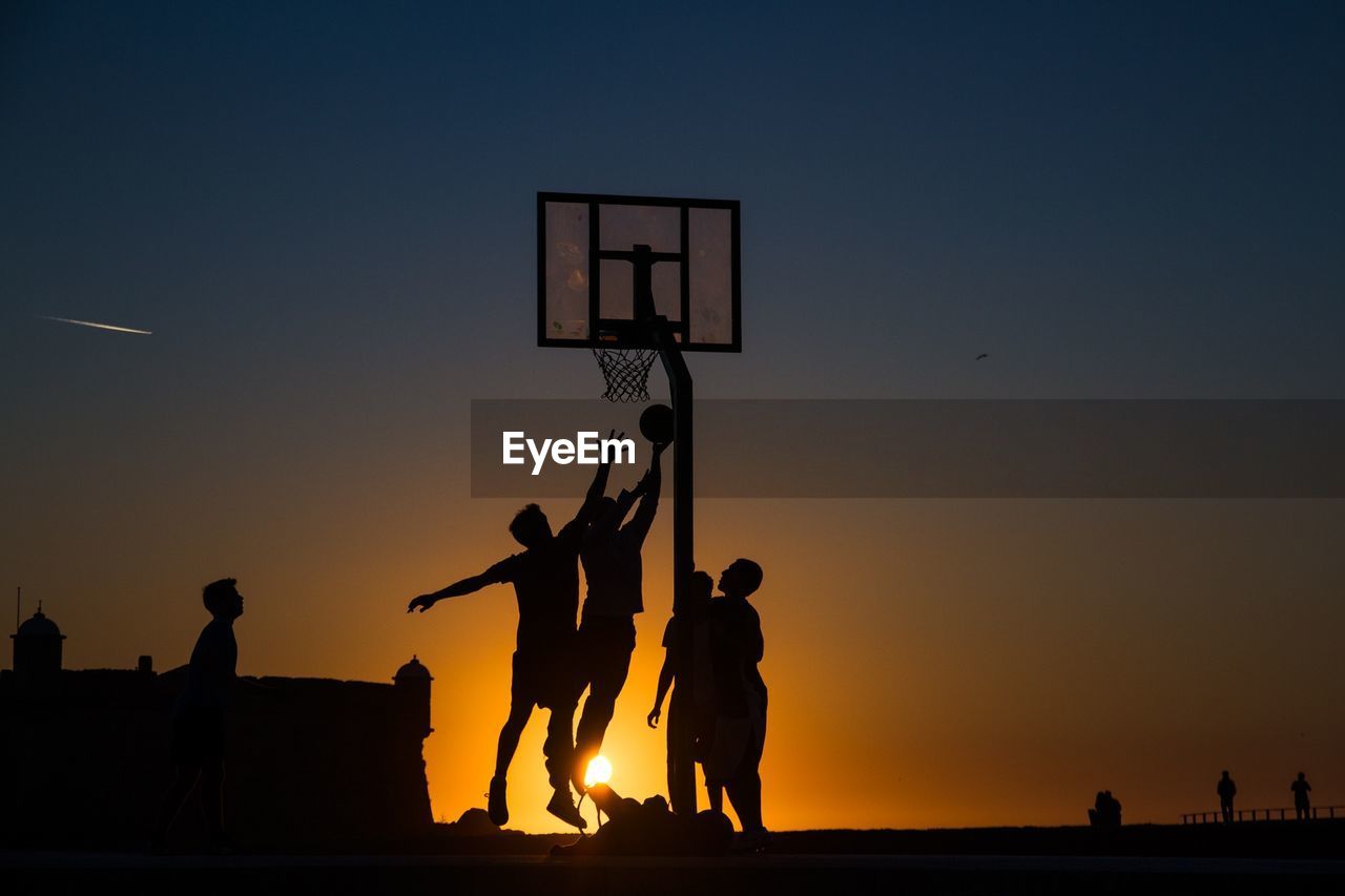 SILHOUETTE WOMAN AT SUNSET