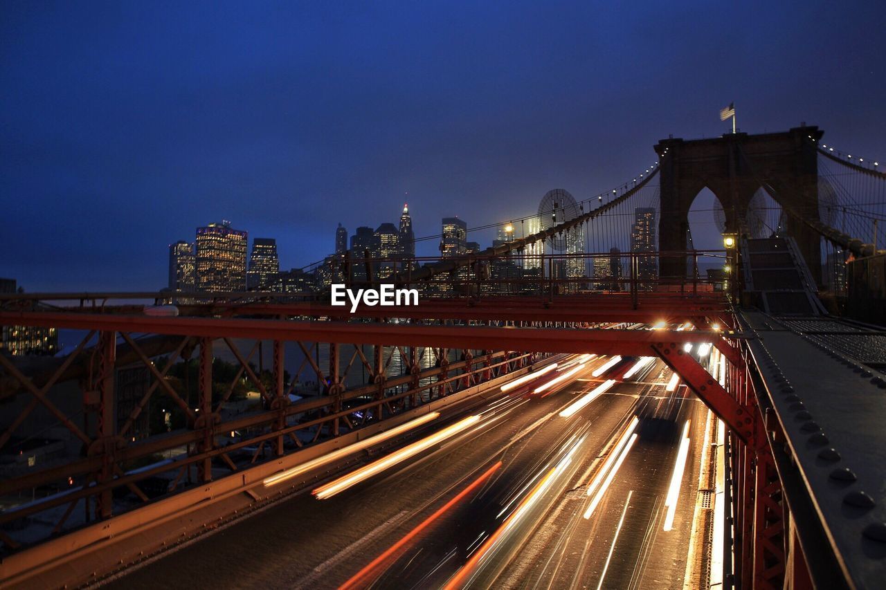 Light trails on suspension bridge at night