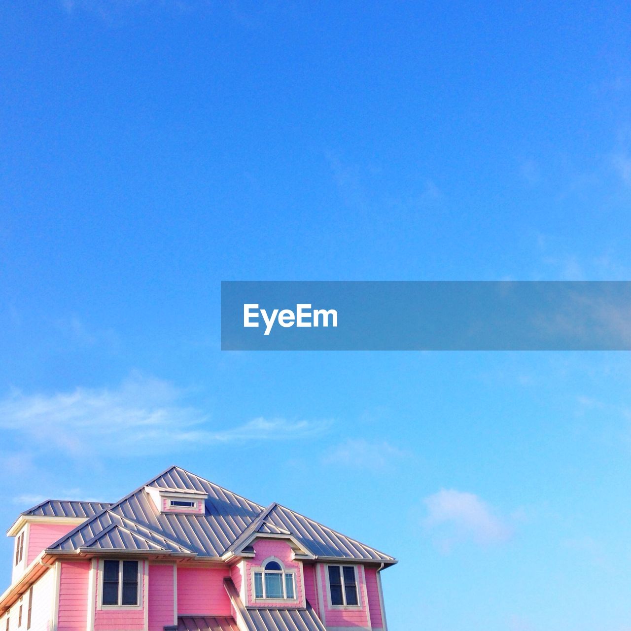 Pink house against blue sky