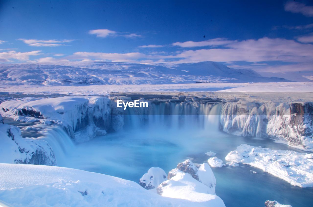 Scenic view of snowcapped landscape against sky godafoss