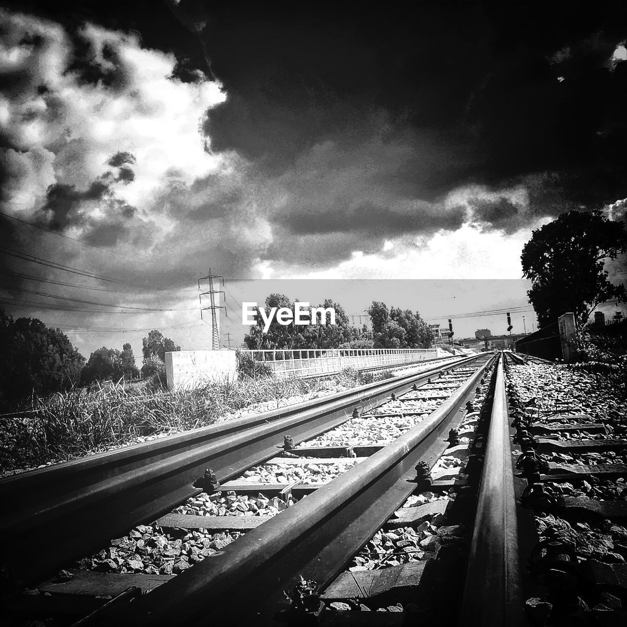 View of railroad track against cloudy sky